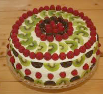 En grön-vit tårta med lite rött i, precis som tävlingdressen blir det på Travkompaniet idag.